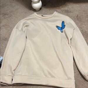 Beige Sweatshirt with Blue Butterfly Patch